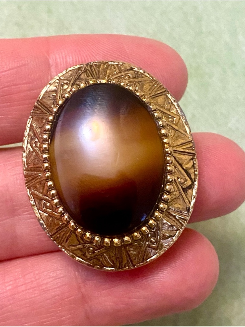 Gold-Tone Oval Brown Cabochon clip. Vintage. Might be tiger eye stone